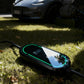 Stella Charge All-In-One Type 2 Portable EV Mobile Charger with LED display, placed on grass outdoors