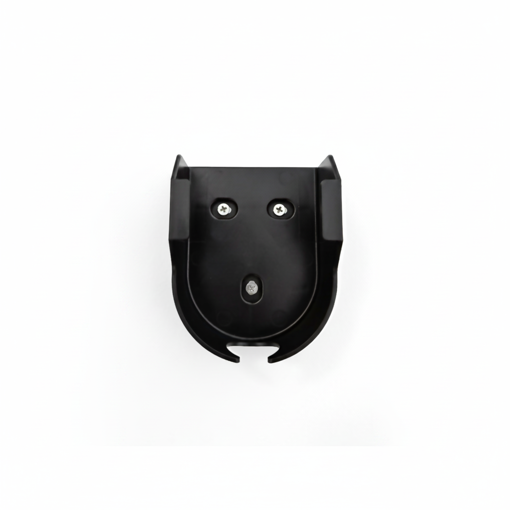 Black wall mount cradle mounted on a wall, purpose-made to house Stella Charge's All-In-One EV Mobile Charger
